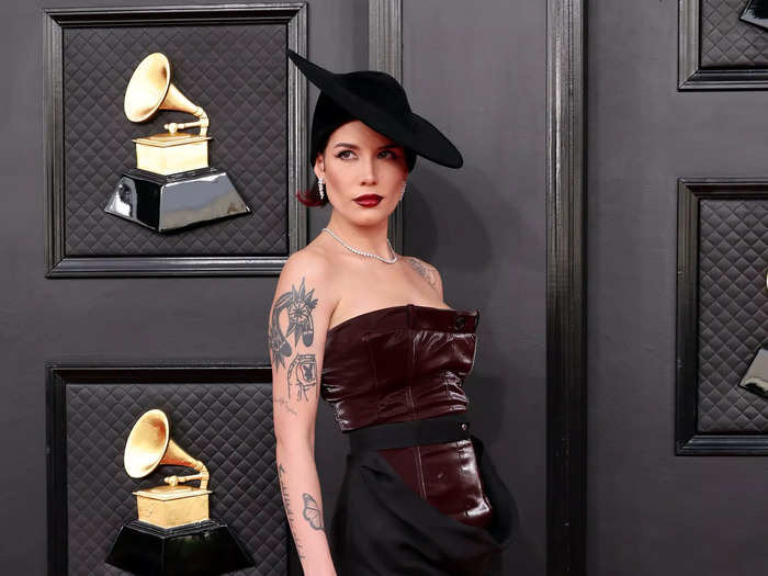 Halsey walked the red carpet in a vampy gown and matching hat.