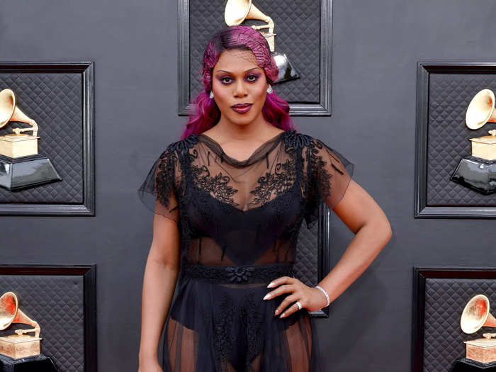 Laverne Cox arrived wearing a completely sheer lingerie-inspired archival look by John Galliano.