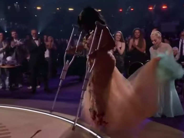 Lady Gaga helped SZA get on stage with her long dress.