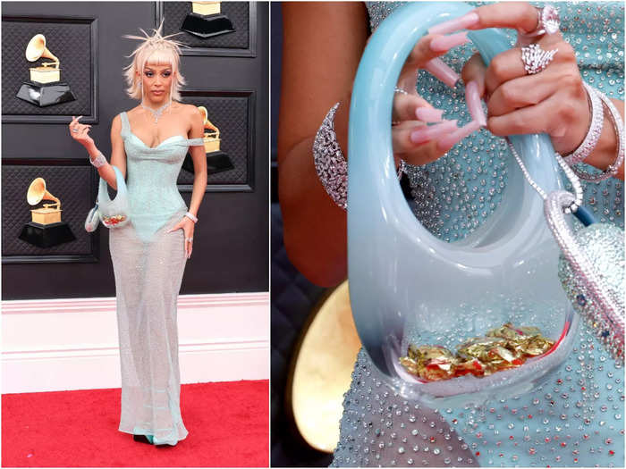 Doja Cat held a candy-filled glass purse with a bedazzled speaker attached to it.