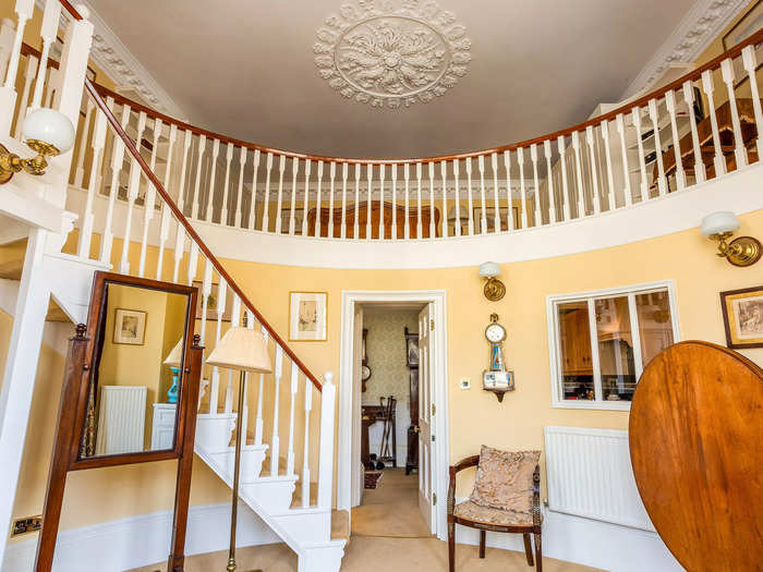 The bedroom is located on a mezzanine overlooking the dressing room and has views of Bath