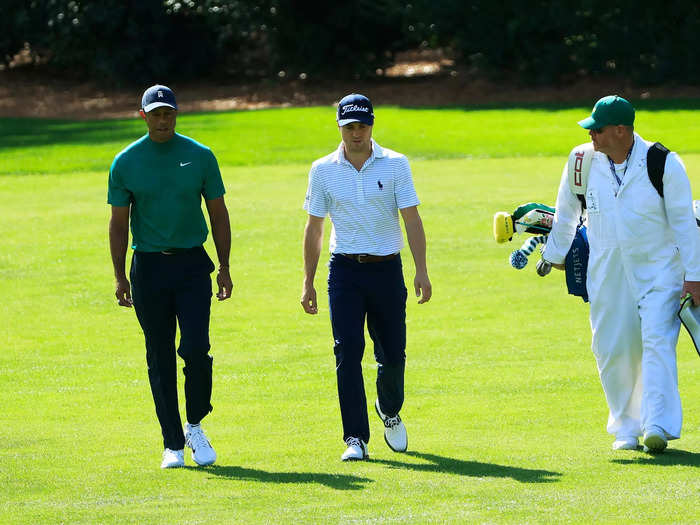 Players are allowed to use their own caddies now, but they have to wear the Augusta uniform — green hat, white jumpsuit.