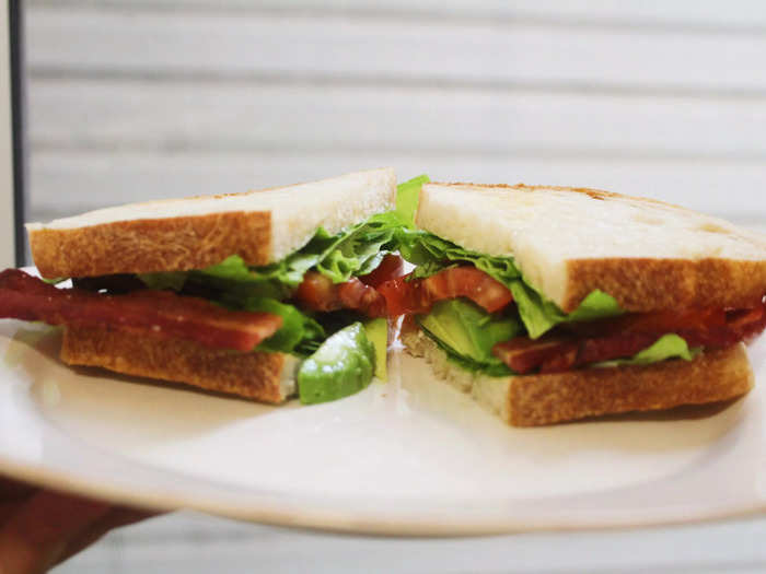 I then assembled the sandwich, placed it on a plate, and cut it in half. The smell of the crispy bacon was already wafting through my kitchen.