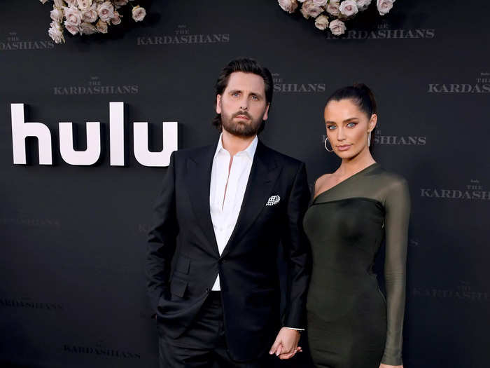 Scott Disick went for a classic black and white suit while his new girlfriend, Rebecca Donaldson, opted for an emerald mini-dress.