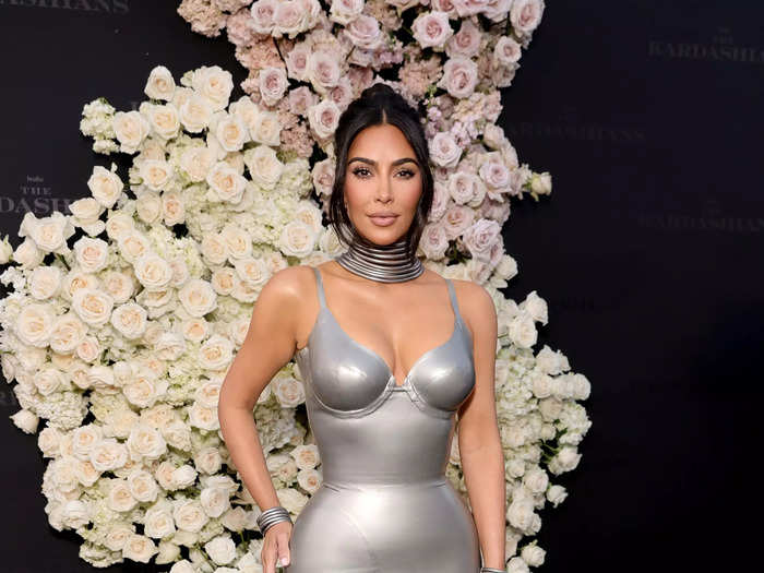 Kim Kardashian wore a body-hugging silver Thierry Mugler gown with matching jewelry.