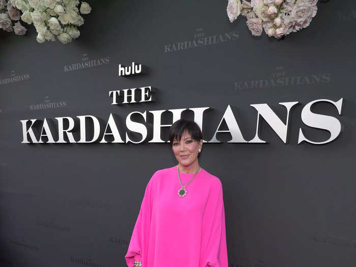 Kris Jenner wore a hot pink long-sleeved dress and rocked her signature pixie haircut.