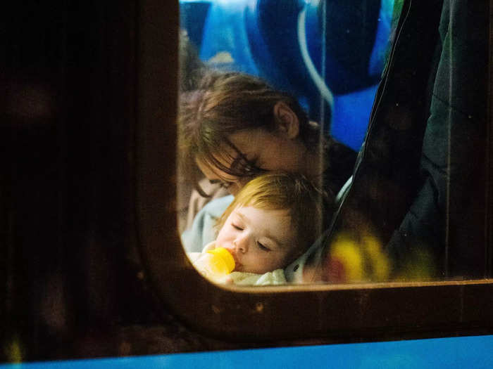 Later, a woman and her child sat on board another train heading deeper into Poland from Przemyśl.