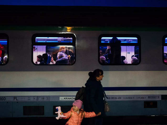 That night, a woman and child rushed by the platform as another train readied to leave Przemyśl station.