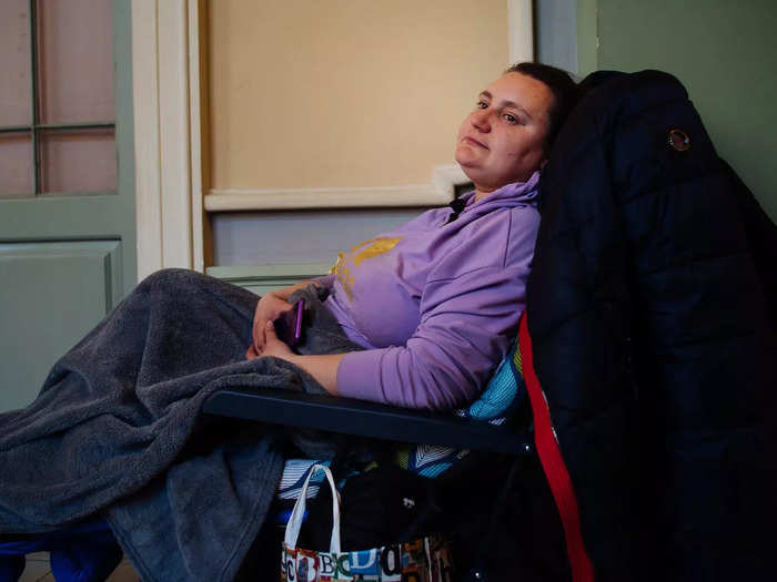 In another part of the Przemyśl station, I saw a woman waiting to be seen by doctors outside of a makeshift medical treatment room.