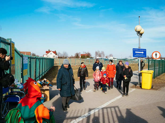 At the main point of entry in Medyka, there was a man dressed in a chicken costume  to boost the morale of kids and families who he greeted as they entered Poland.