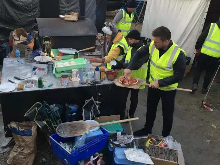 The charity has trained five local people on the Polish border to help cook pizzas at the camp.