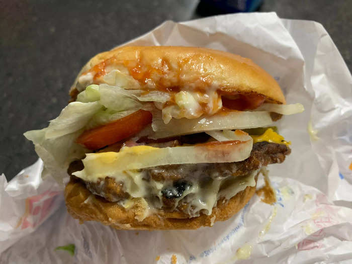 I had to remove some of the toppings to eat it. The ratio of burger to other components seemed off, making every bite too soft and wet.