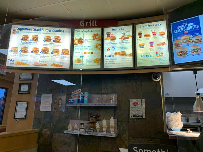The interior felt like a typical fast-food restaurant, with a menu board highlighting the new Stackburgers.