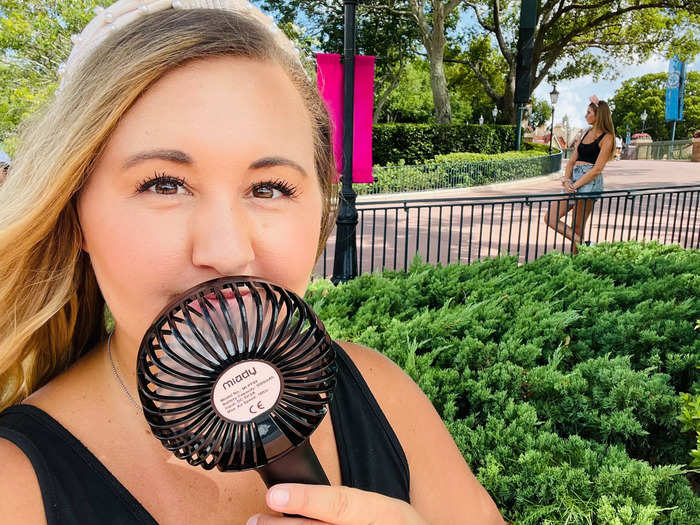 A handheld fan can be a lifesaver on a hot day.