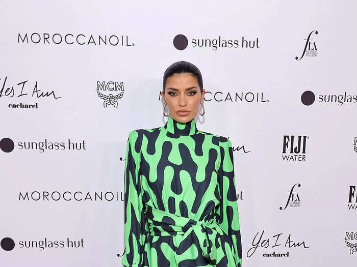 Model Nicole Williams English arrived in an all-green ensemble with bold prints.