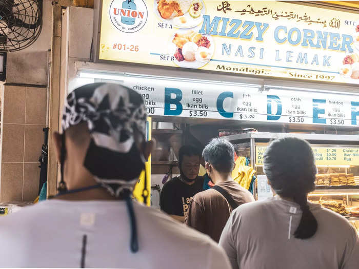 More than a dozen people were lining up for nasi lemak by 8 a.m. Many diners were having the famed dish for breakfast.