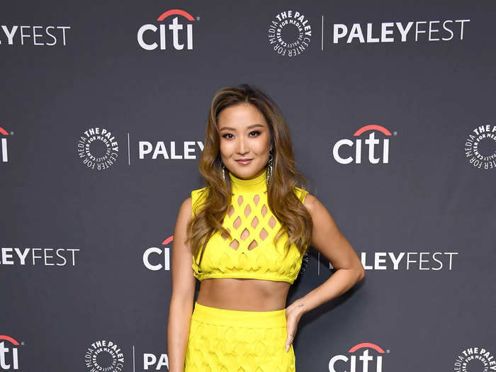 Ashley Park made a statement in a bright-yellow mesh two-piece and drop earrings.