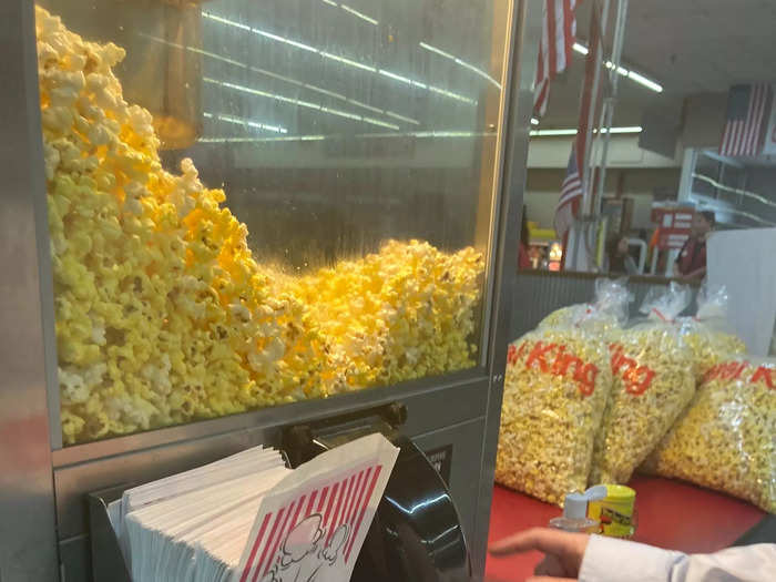 Anyone can grab a paper bag, fill it up with freshly popped popcorn, and munch on it as they shop.