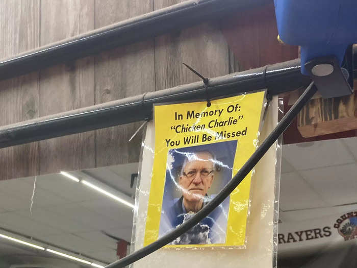 At the Greenwood store, a memorial dedicated to a man once known as "Chicken Charlie" overlooks the tubs.