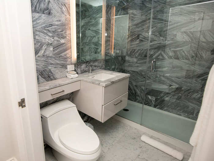 … as well as a marble-filled bathroom with all the basic amenities.