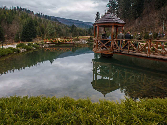 An artificial lake imbues the property with a pastoral ambiance.