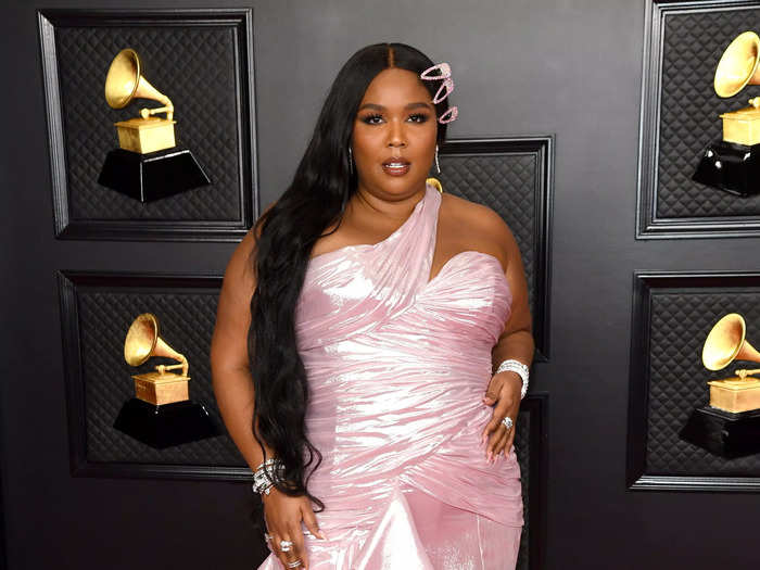 Lizzo had a mermaid moment in a shiny-pink gown at the 2021 Grammy Awards.