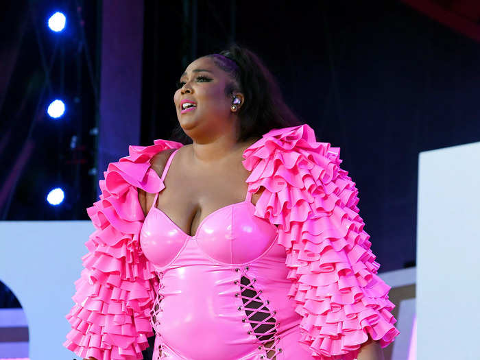 Lizzo wore a pink PVC unitard and a matching ruffled jacket to perform at Global Citizen Live 2021.