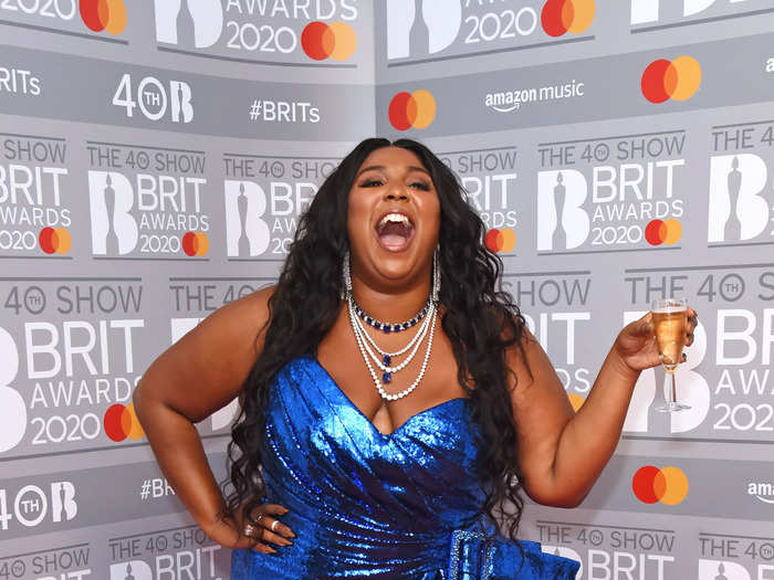 Later at the 2020 Brit Awards, Lizzo changed into a blue sequin dress with layered necklaces.