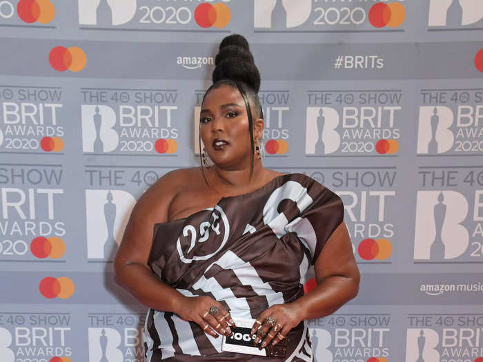 Lizzo walked the red carpet at the 2020 Brit Awards dressed as a glamourous Hershey