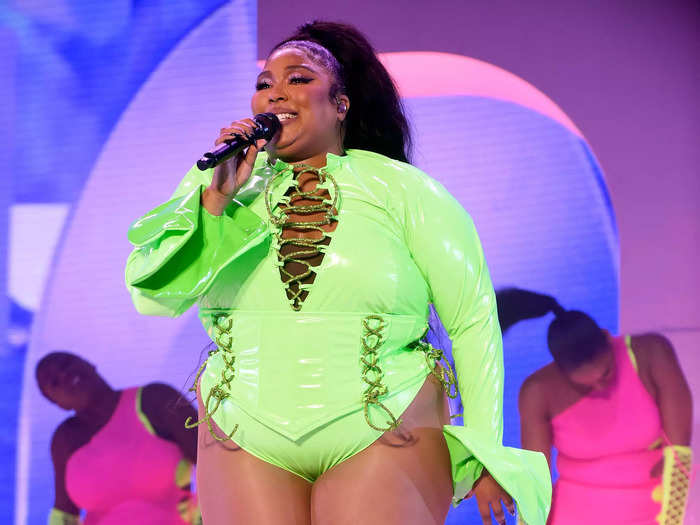 Lizzo wore one of her signature leotards in neon-green latex to sing at the Outside Lands Music and Arts Festival 2021.