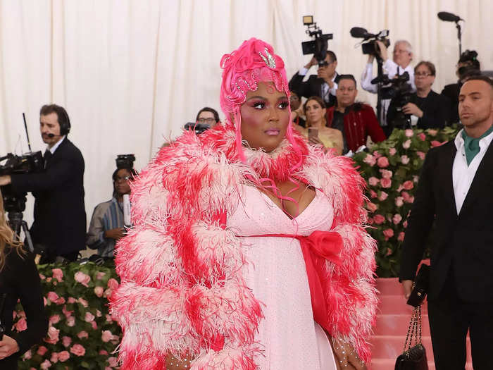 At the 2019 Met Gala, Lizzo was a pink marvel in a two-tone feather coat and a matching Regency-style wig,