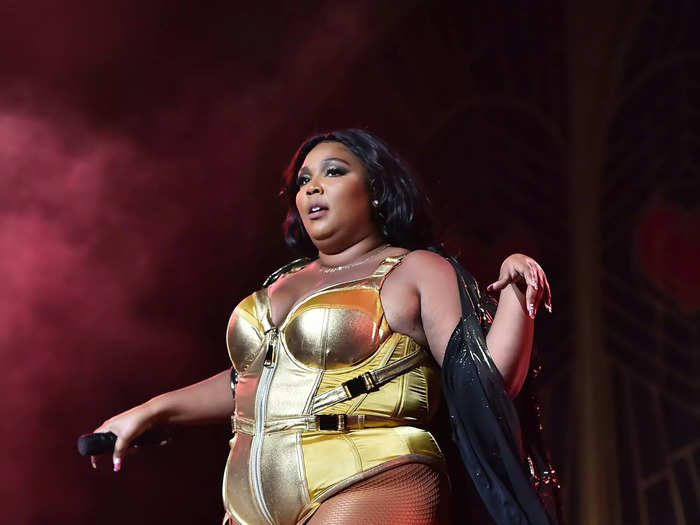 In 2019, Lizzo wore a gold leotard and matching boots while performing one of two sold-out shows at Radio City Music Hall, New York City.