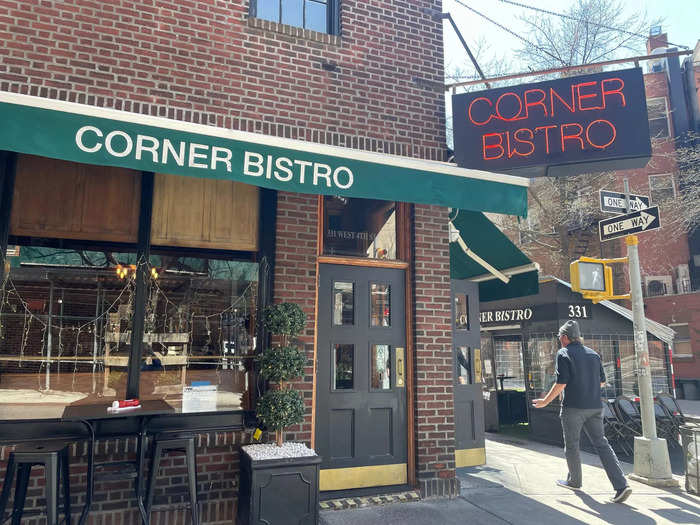 With a neon sign and labeled awnings, this pub is hard to miss.