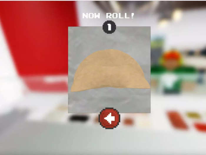 Once the ingredients are added, use the arrow keys to roll up the burrito.