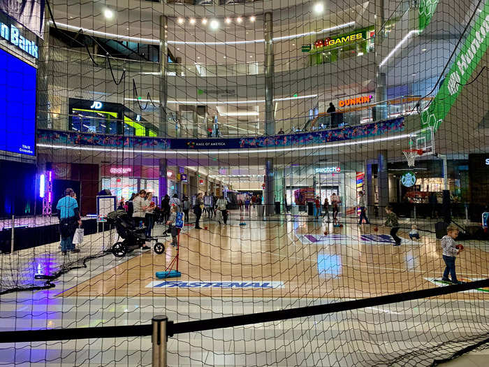 Part of the center is occupied by a large basketball court, which is surrounded by a net. There