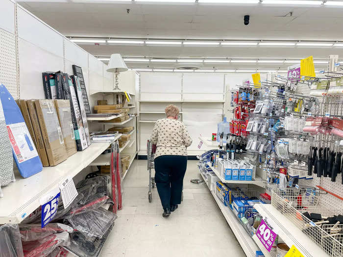 And as they shopped, workers continued cleaning out the store and reorganizing the disheveled shelves as if its closure wasn