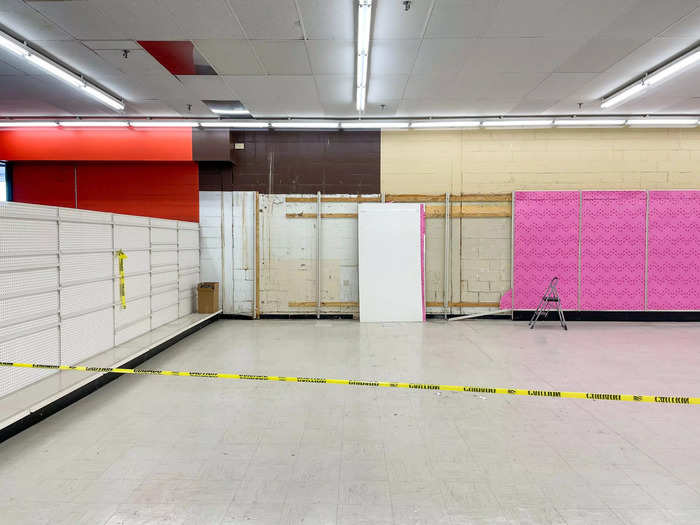 The bright overhead lights emphasized the rows of bare racks and shelves, a reminder of the big-box retailer