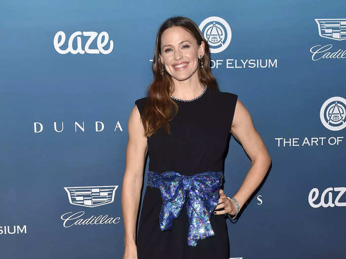 Garner wore this black dress with a large blue sequined bow at the Art of Elysium