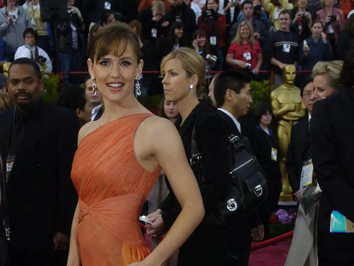 Garner attended the 2004 Academy Awards in this unique one-shoulder orange gown with a taffeta train.