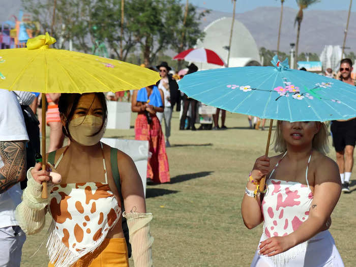 Parasols were allowed at the festival to help shield people from the sun.