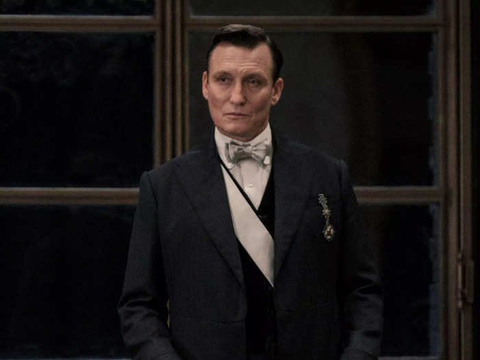 Oliver Masucci plays Anton Vogel, the German Minister of Magic.