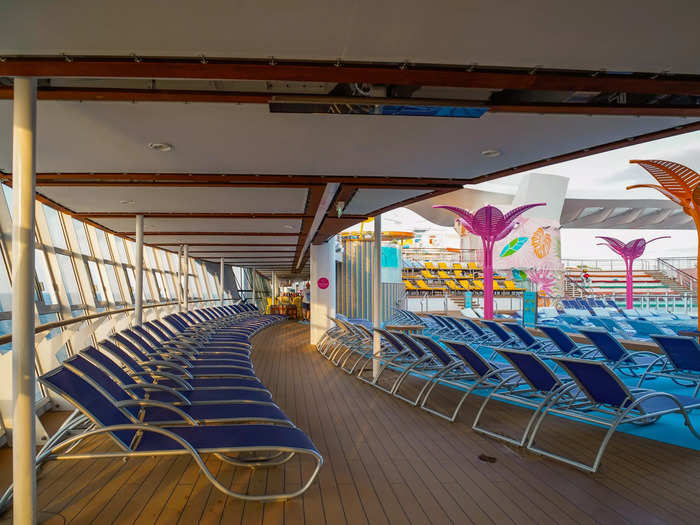 Surrounding each pool are rows of lounge chairs, both in and out of the shade.