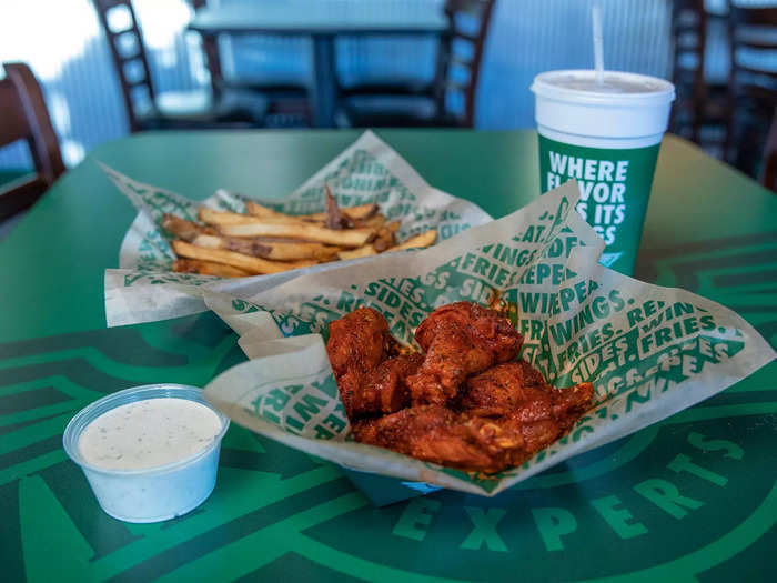 Wingstop is known for its menu full of munchies — specifically, popular flavors like original hot, garlic parmesan, and lemon pepper.