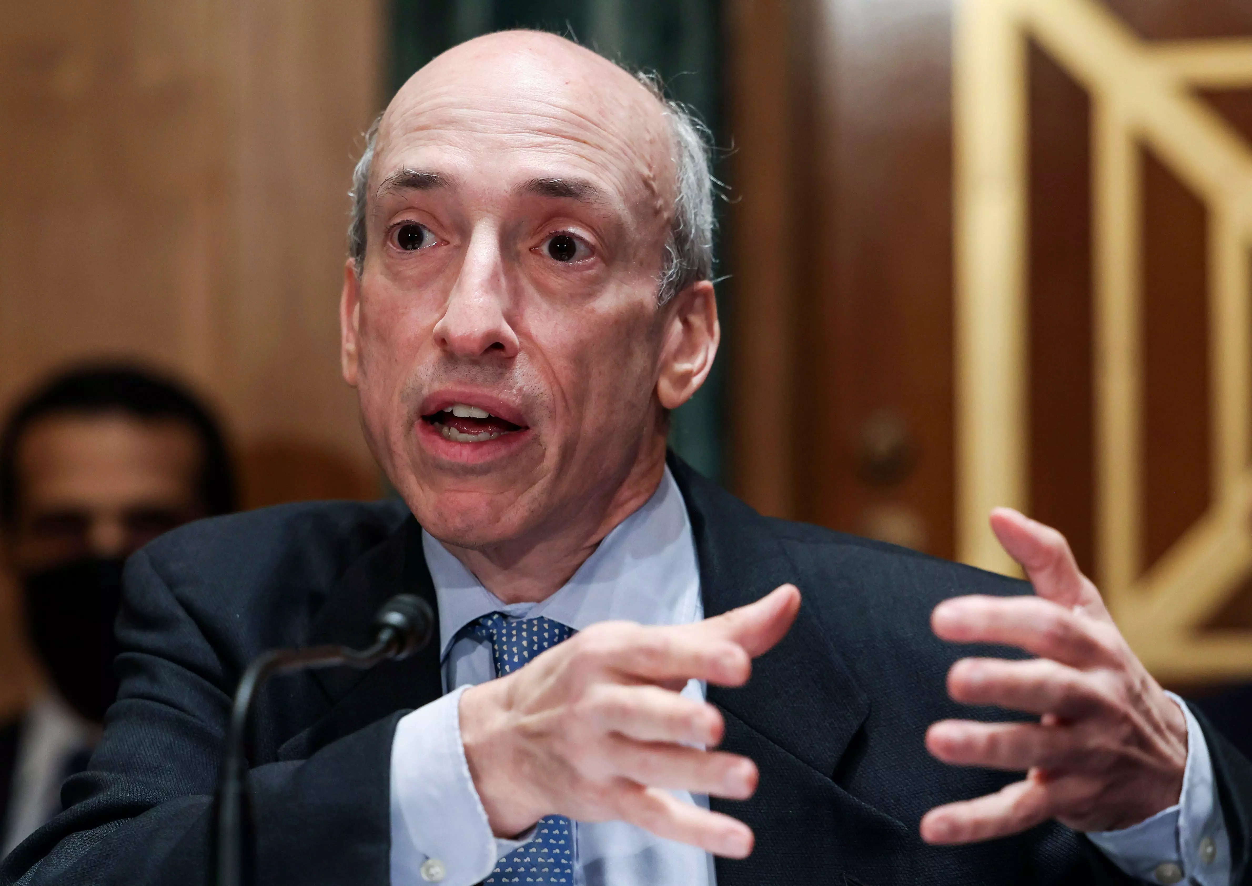 Securities and Exchange Commission, Chairman Gary Gensler speaks and gestures with his hands, during a Senate Banking, Housing, and Urban Affairs Committee hearing on "Oversight of the U.S. Securities and Exchange Commission" on Tuesday, Sept. 14, 2021, in Washington.