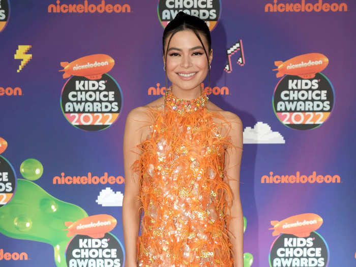 Miranda Cosgrove matched her feathery orange minidress to the orange carpet at Nickelodeon