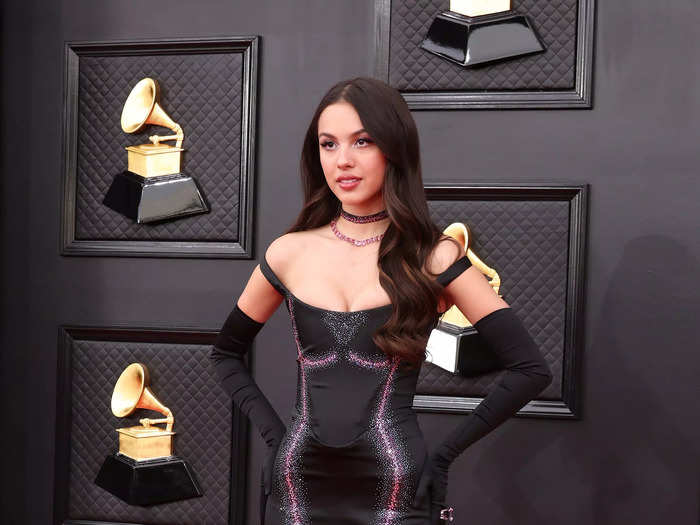 Olivia Rodrigo proved that goth glam is here to stay (at least for 2022) with this skintight dress with long black gloves and two chokers at the Grammys.