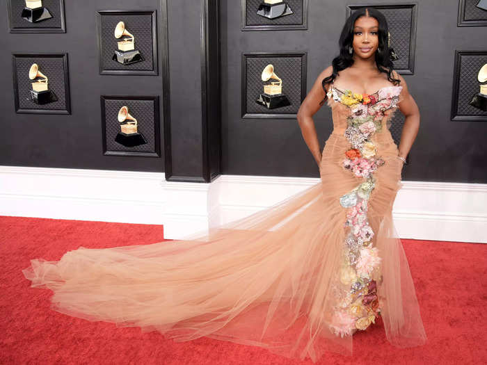 SZA looked like a flower goddess at the Grammys in this tan tulle mermaid gown covered in flowers.