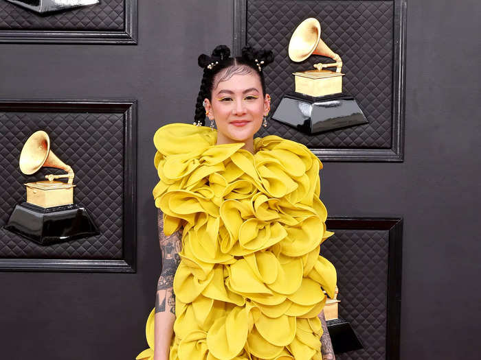 Michelle Zauner of Japanese Breakfast walked the Grammys red carpet in this bold yellow minidress.