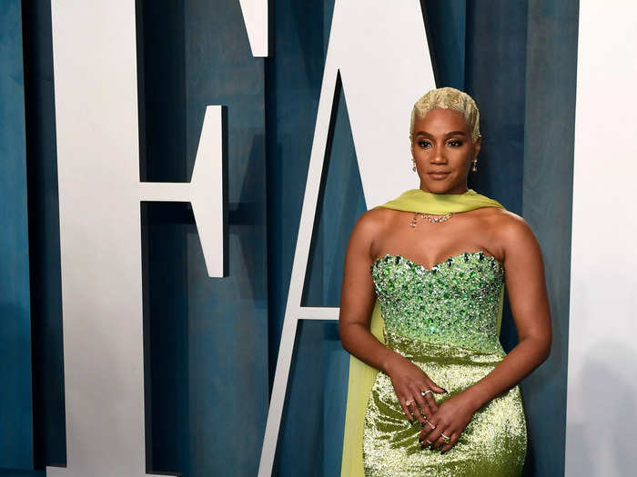 Tiffany Haddish glowed in her shimmering lime-green dress with a green cape at Vanity Fair