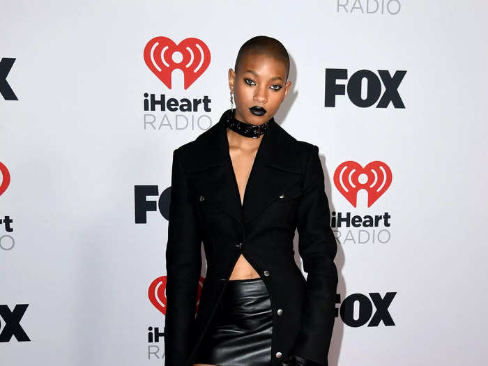 Willow Smith walked the red carpet of the iHeartRadio Music Awards on March 22 in this leather miniskirt, thigh-high boots, and floor-length coat.